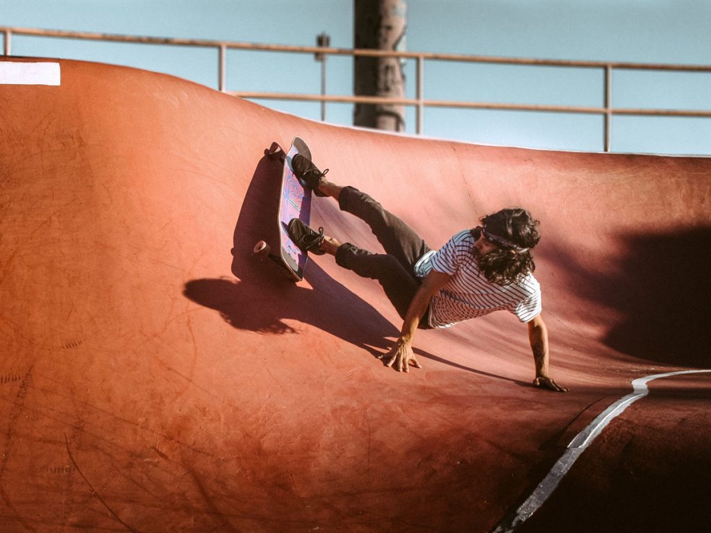 skateboarder in striped shirt