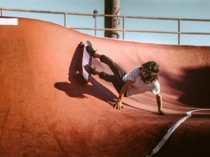 skateboarder in striped shirt