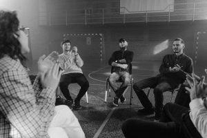 small group seated in a circle.