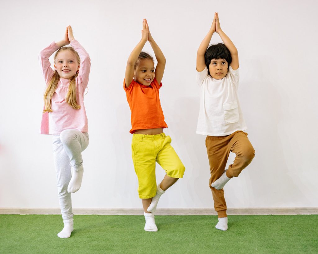 3 kids in yoga poses