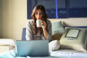 woman with morning coffee and laptop
