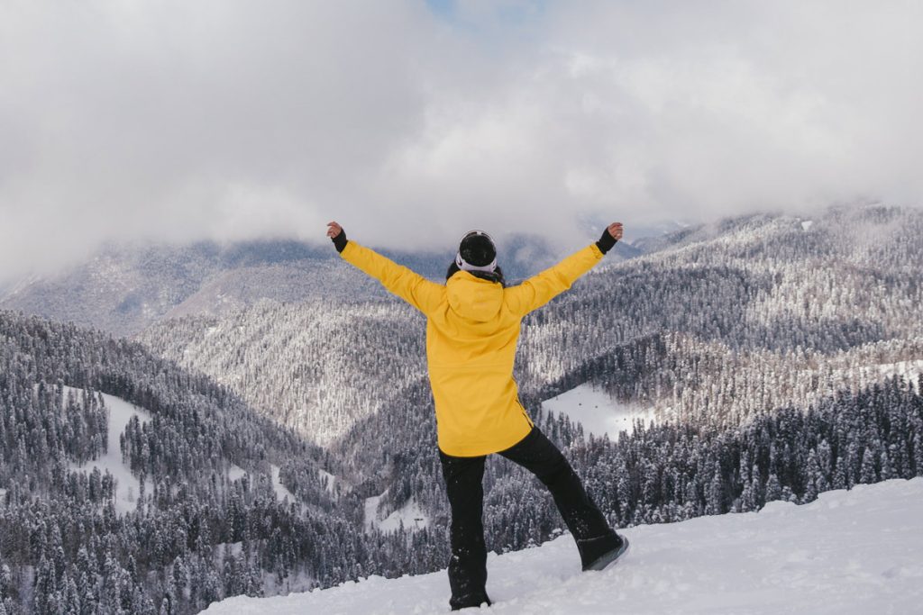 woman on a mountain in the clouds