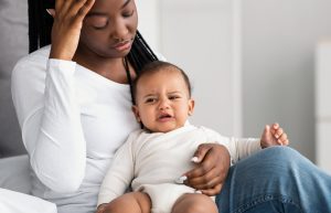 stressed mother with baby