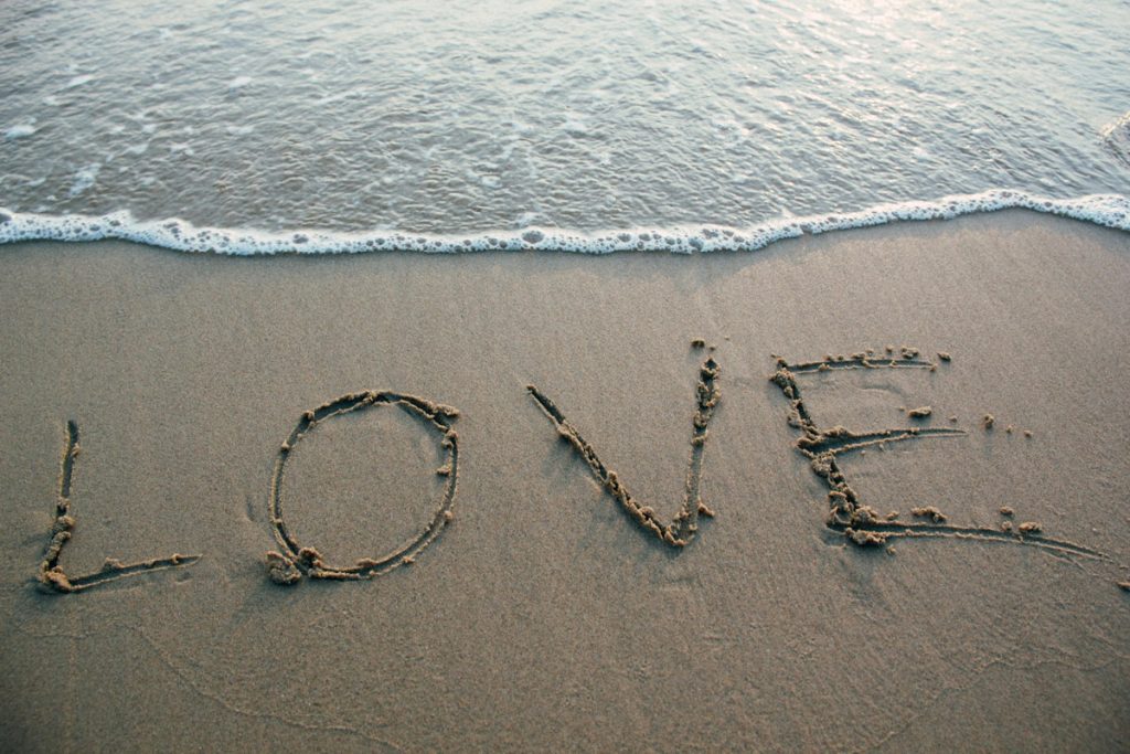 word ‘love’ written in the sand