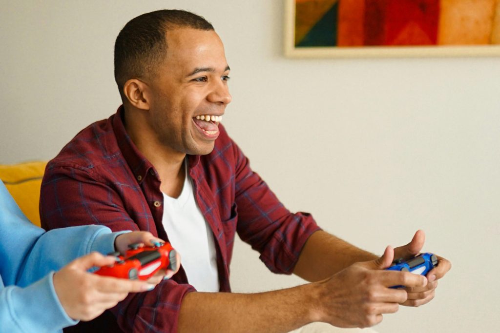 happy gamers with controllers.