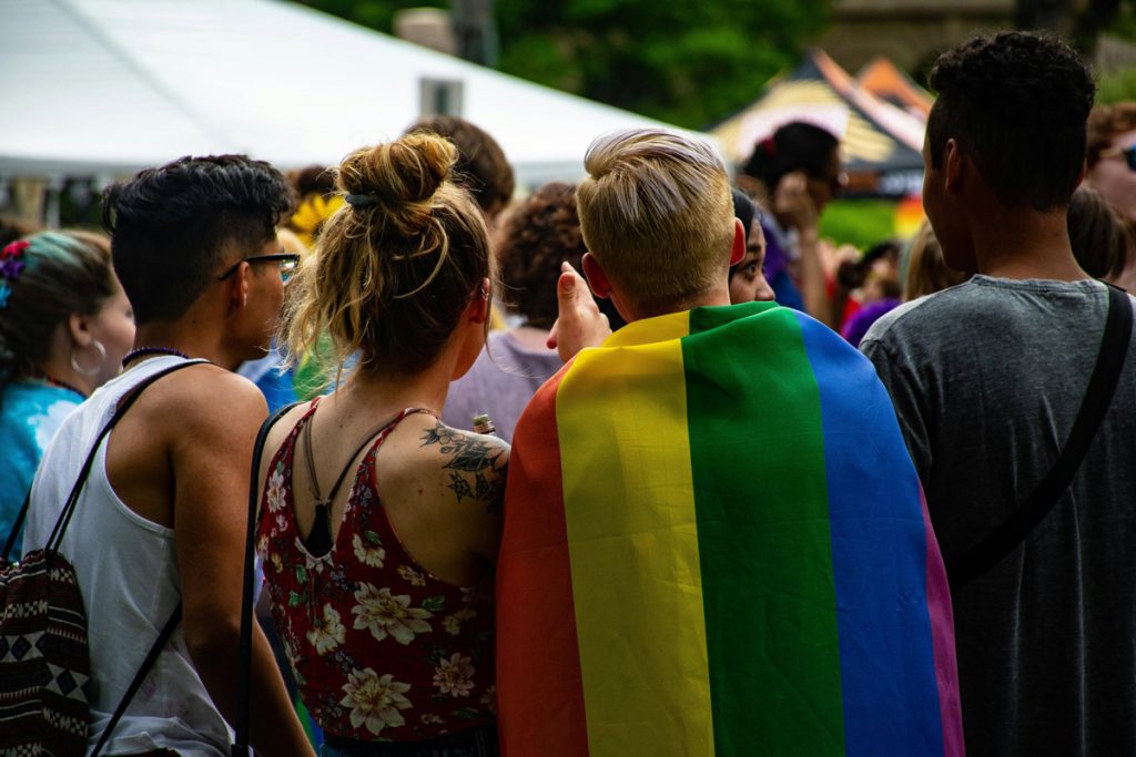 group of friends with pride flag