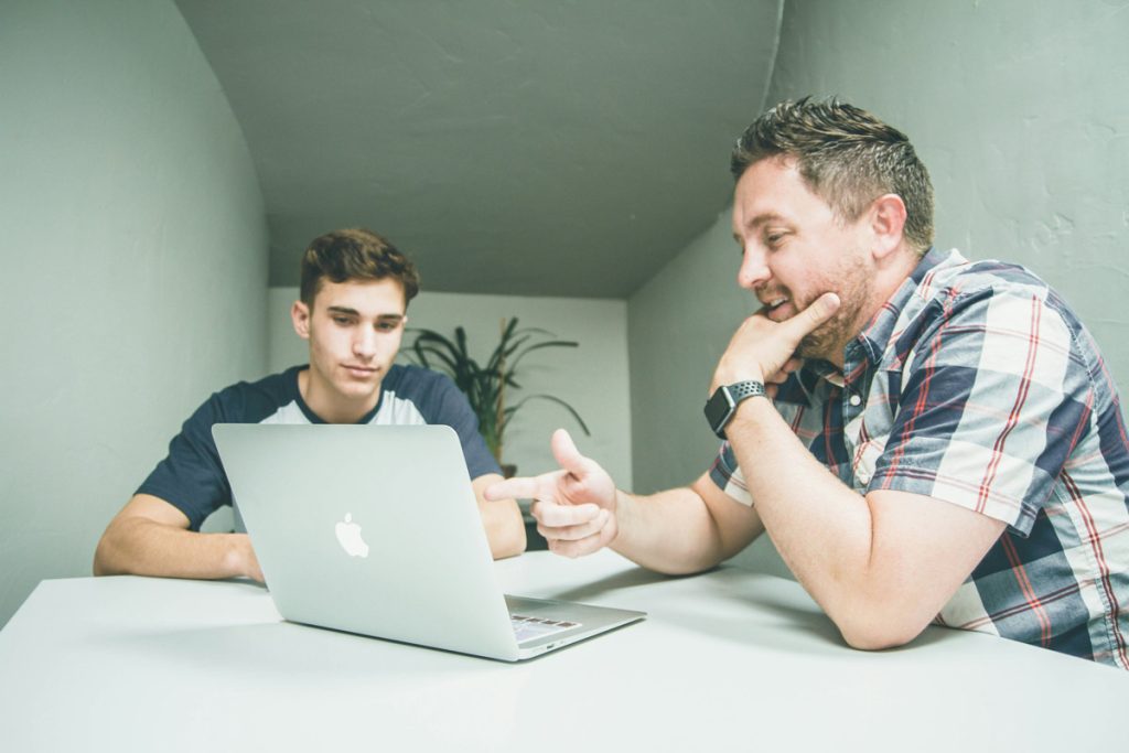 two friends with laptop