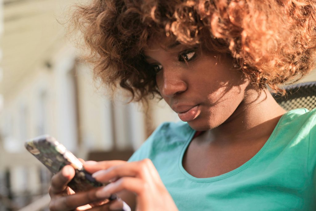 woman scrolling smartphone