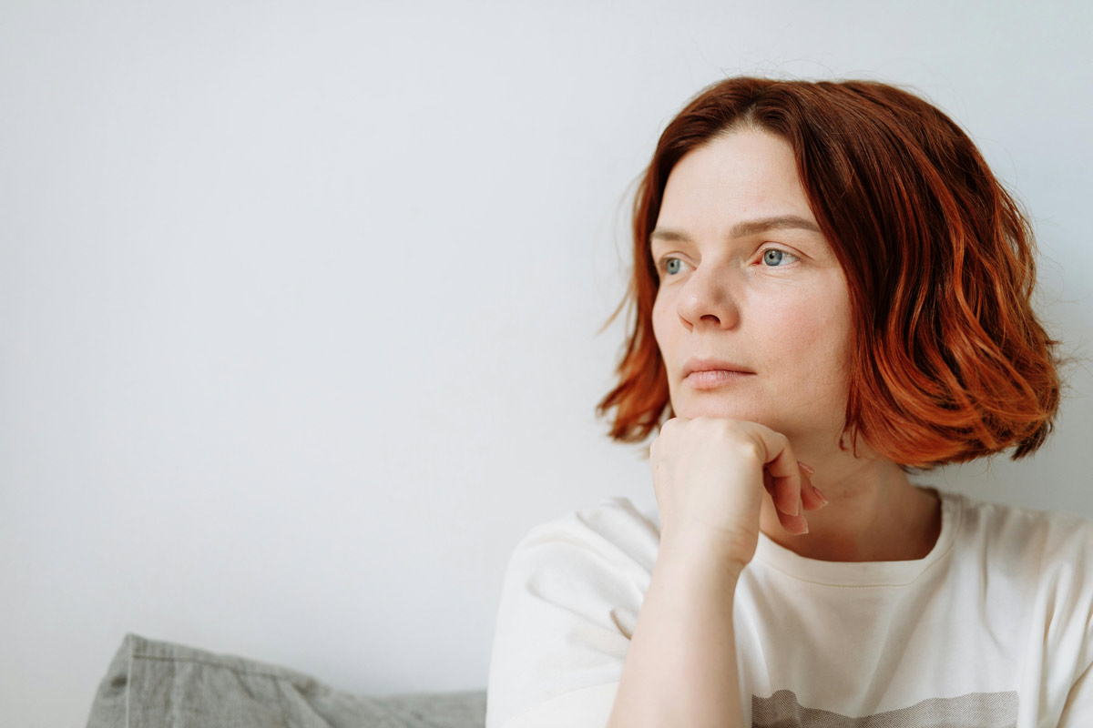 Close up of woman’s face with thoughtful expression.