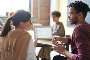 Mental health counselor providing supportive information to a client.